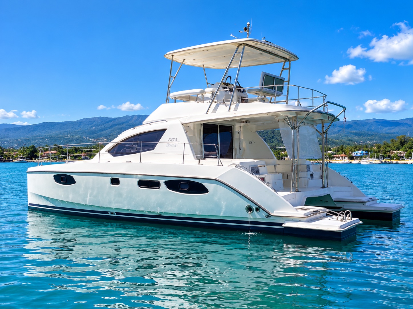 Side view of the catamaran with mountains in the distance