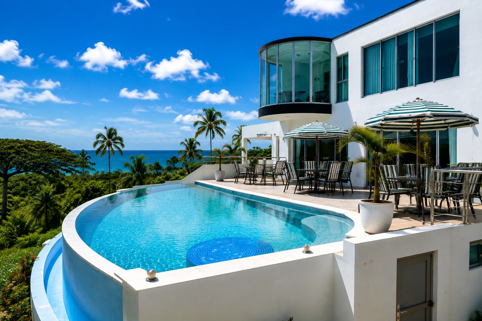 Infinity pool overlooking palms and the Atlantic Ocean
