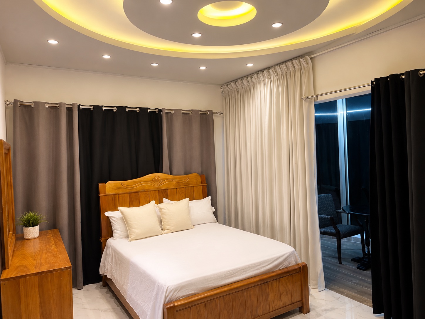 Comfortable guest suite with a queen bed and curved ceiling